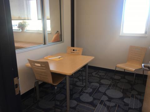 Small study room with chairs and whiteboard. 