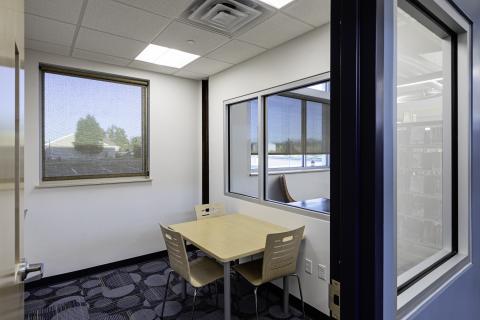 Small study room with 3 chairs and a whiteboard. 