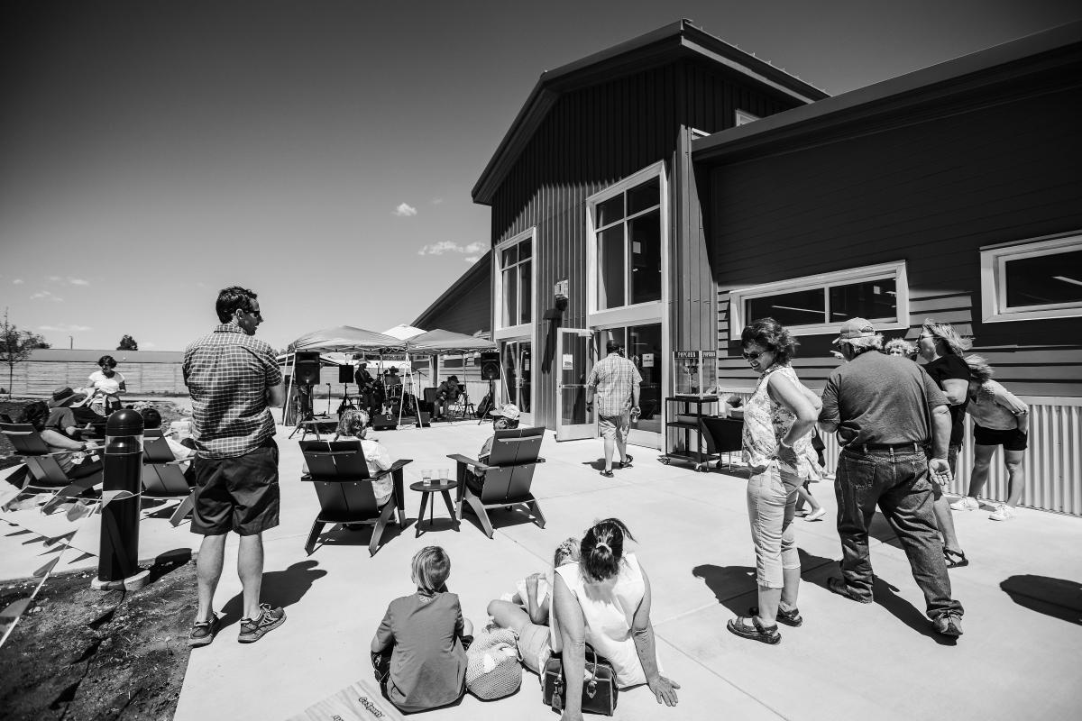 People gathered on the patio of the library.